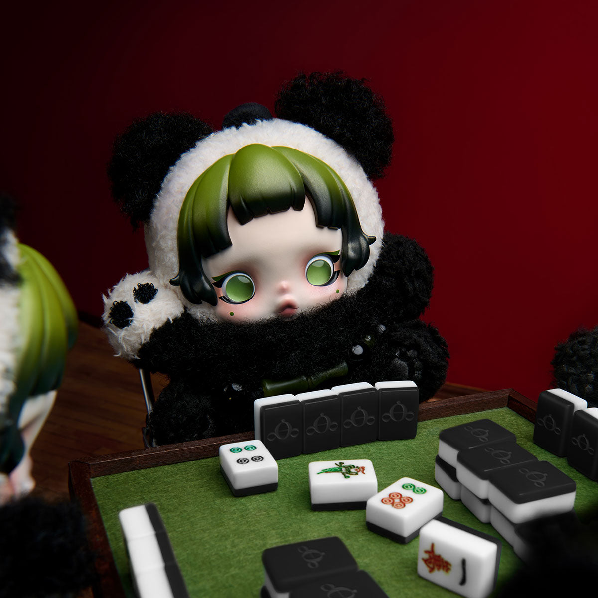 SKULLPANDA Lazy Panda plush pendant at a mahjong table