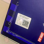 skullpanda Scratch-off card with QR code on a blue surface with Pop Mart branding.