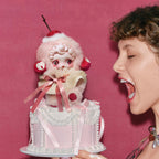 Pink You Found Me plush character on a cake