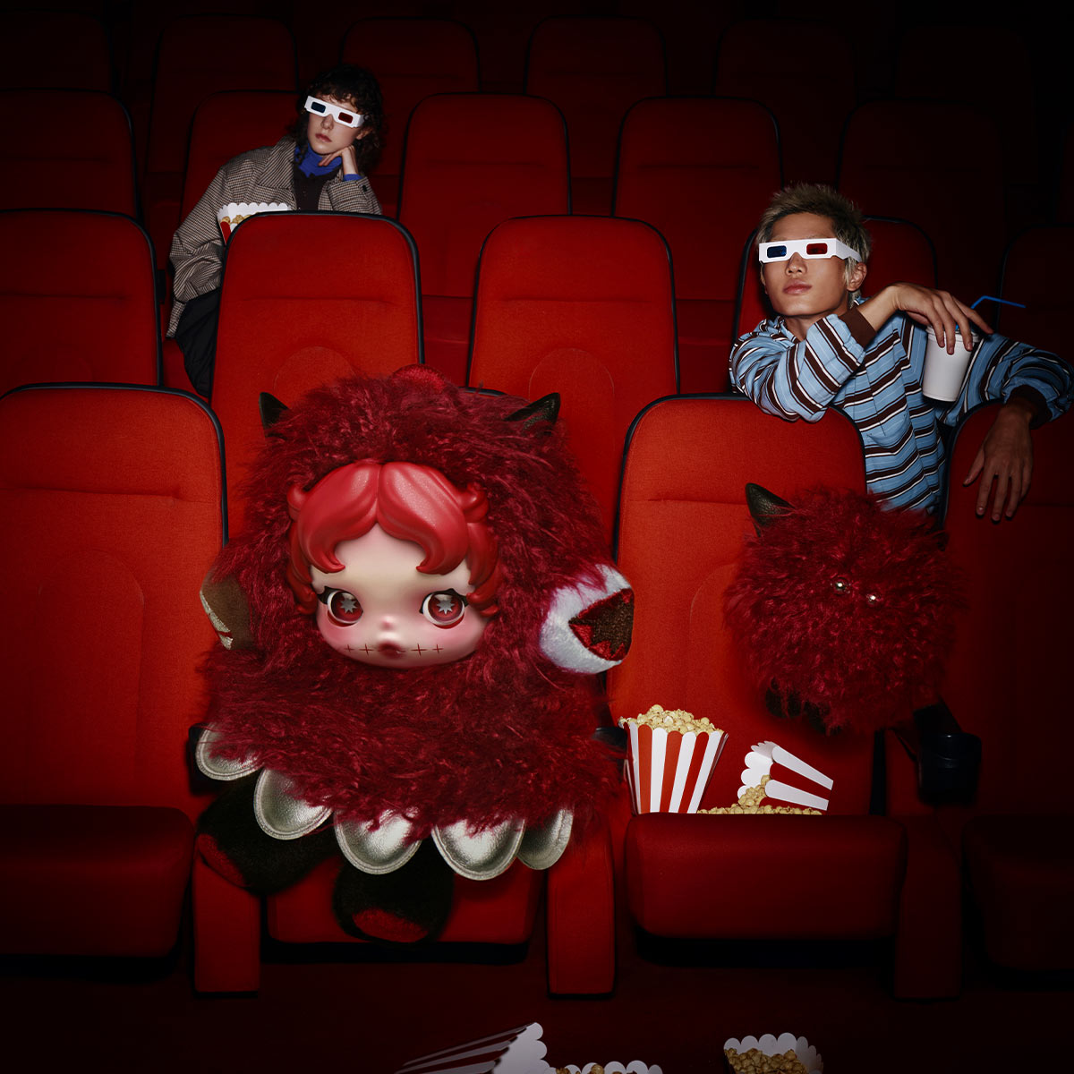 Red You Found Me plush character in a cinema