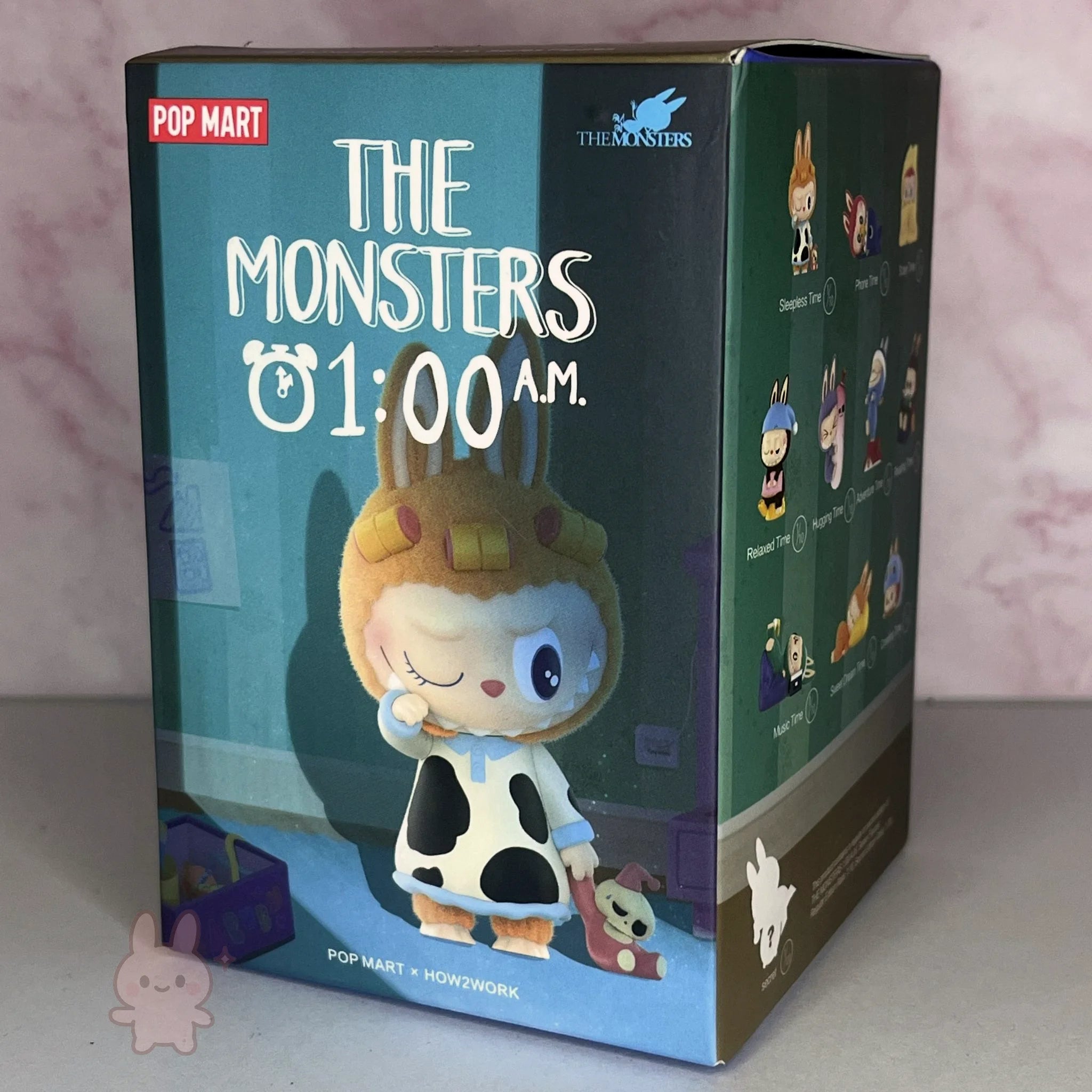 the-monster-1am-series Box packaging of 'The Monsters 1:00 AM' by Pop Mart with character illustration on a light pink background.