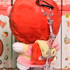 hello kitty Plush keychain with a transparent tube against a colorful background