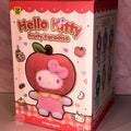 Hello Kitty Fruity Paradise plush toy packaging with a pink apple design.