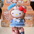 sanrio-afternoon Plush toy resembling a character with a blue bow and red flower, held in front of a box with cartoon characters.