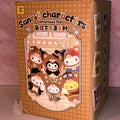 sanrio-afternoon Box of Sanrio character toys with a checkered design and cartoon characters on a pink background.