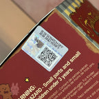 Twinkle Twinkle Savor the Moment Scratch-off verification card with QR code on a product packaging with warning label.