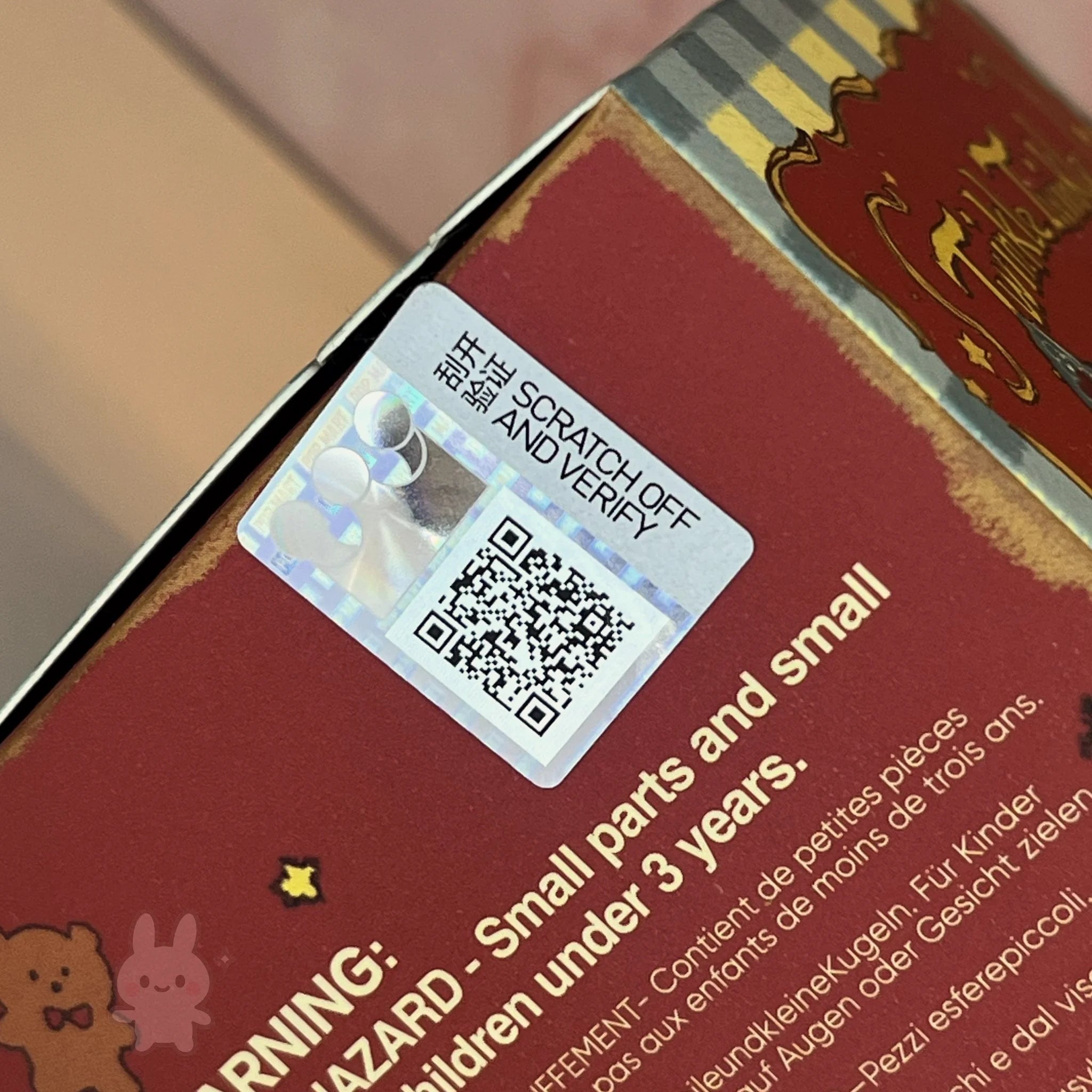 Twinkle Twinkle Savor the Moment Scratch-off verification card with QR code on a product packaging with warning label.