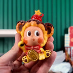 Twinkle Twinkle Savor the Moment Toy lion figure with a star on its head held in a hand against a blurred background