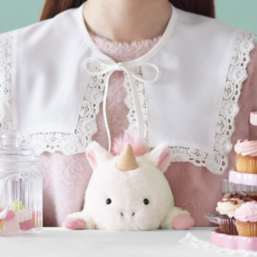 Posture Pal Unicorn sitting at a desk