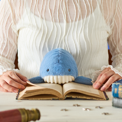 Posture Pal Whale sitting at a desk